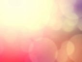 Abstract Holiday Lights Twinkled Bright Background With Bokeh Defocused Colorful Lights. Festive Bac