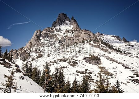 Snowy peaks of a mountain in winter