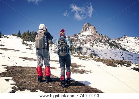 Tourists climbing mountains