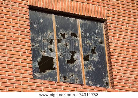 Close up of a Broken Window on an old Brick Building