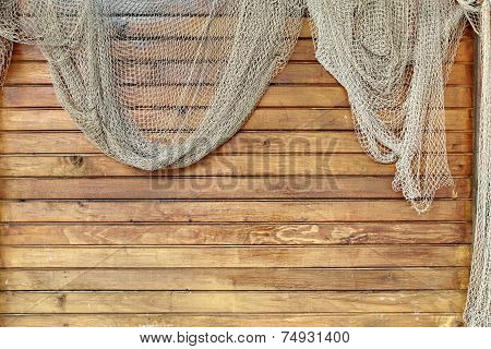 Hanging Fishnet On Wood Wall
