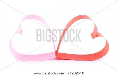 Heart shaped red and pink paper ribbon isolated on white