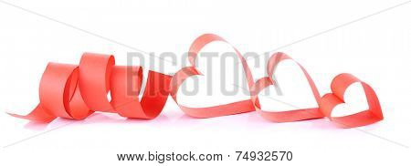 Heart shaped red paper ribbon isolated on white