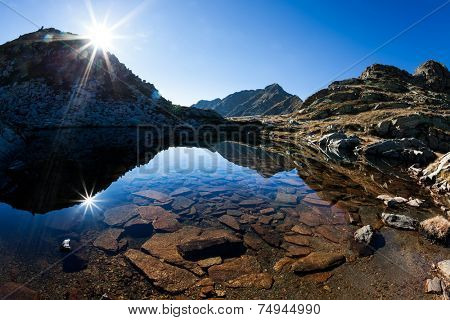 Mont Mars reflected in the Rosso lake in a sunny autumn day. Biella, Piemonte, West italian Alps, Europe.