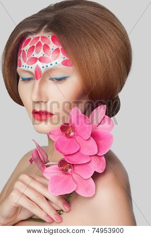 Creative shoot. Beautiful fashion woman With Conceptual Creative Makeup With Dispersion Effect