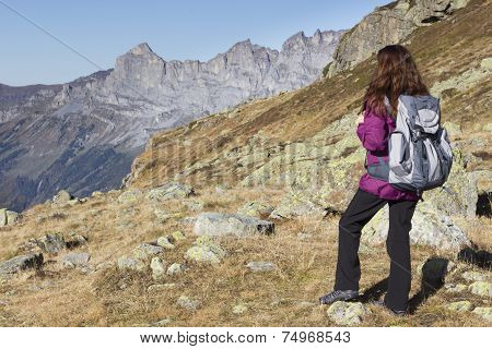 Woman Enjoying The Swiss Alps During Hiking In Autumn