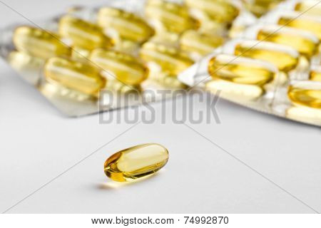 Close up of yellow transparent gel caps