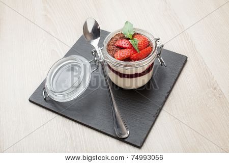 Delicious Italian Cream Dessert Pannacotta With Grated Chocolate, Strawberry, Basil