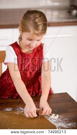 Little girl baking christmas cookies