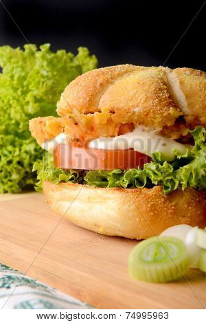 Appetizing fish burger with leek