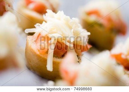 Preparing bruschetta for evening snack