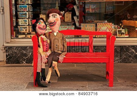 Handmade Lover Dolls On Red Bench, Bratislava , Slovakia.
