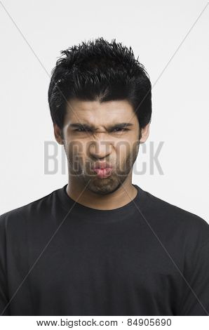 Portrait of a man puckering