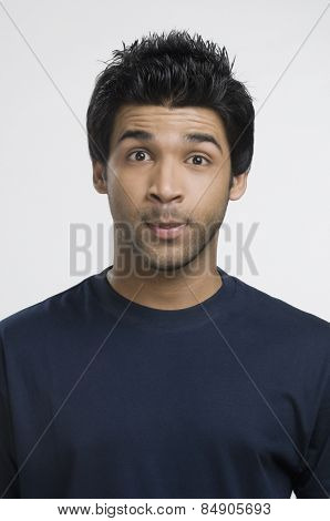 Man looking surprised with his raised eyebrows