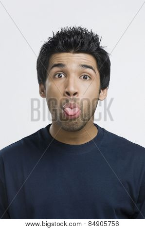 Man sticking his tongue out