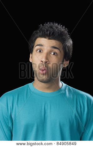 Close-up of a man looking surprised