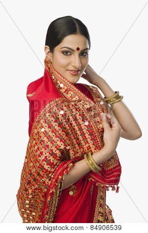 Woman in bright red mekhla