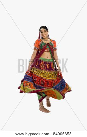 Woman dancing in colorful lehenga choli