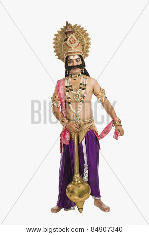 Portrait of a man dressed-up as Ravana the Hindu mythological character and holding a mace