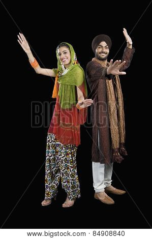 Portrait of a Sikh couple dancing