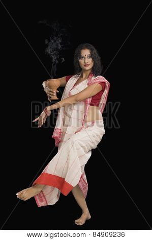 Bengali woman performing ritual dance