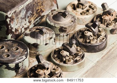 Close-up of abandoned lightswitches and sockets