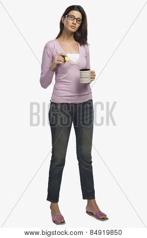 Female fashion designer drinking coffee