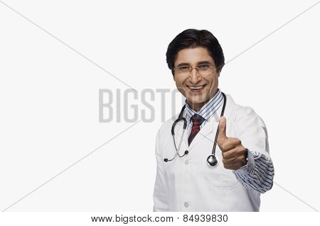 Portrait of a doctor showing thumbs up and smiling