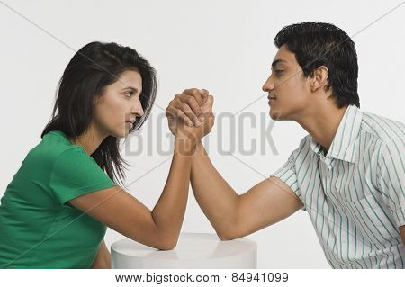 Couple arm wrestling