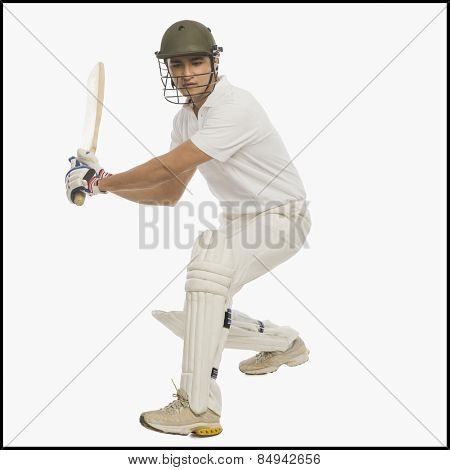 Cricket batsman playing a stroke