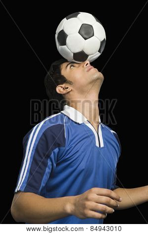 Soccer player practicing with a soccer ball