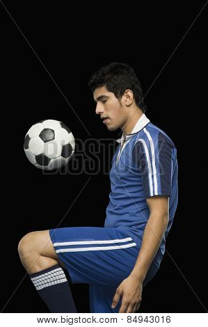 Soccer player practicing with a soccer ball