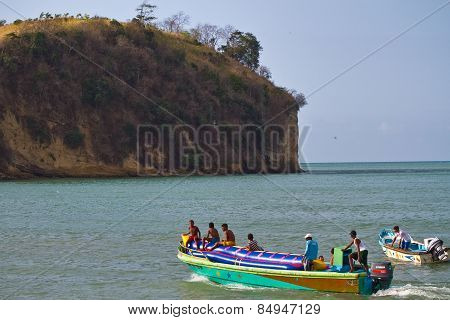 Unidentified young boys resting in an inflatable banana boat, Sua, Esmeraldas.