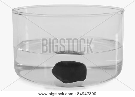 Close-up of a stone sunk in a bowl of water