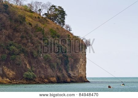 Unidentified tourists enjoying the beach of Sua kayaking.