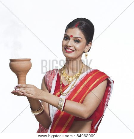 Traditional Bengali woman praying