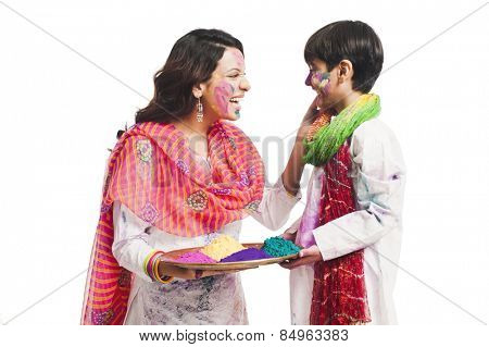 Woman celebrating Holi festival with her son