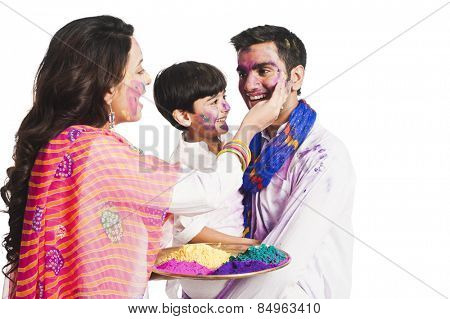 Family celebrating Holi festival