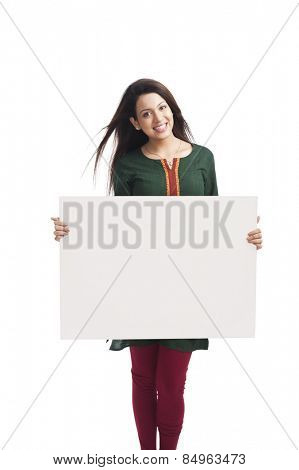 Portrait of a happy woman holding a whiteboard