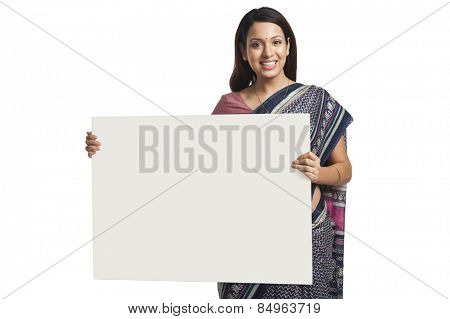 Woman holding at a whiteboard and smiling