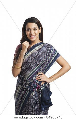 Happy woman standing with her hand on hip