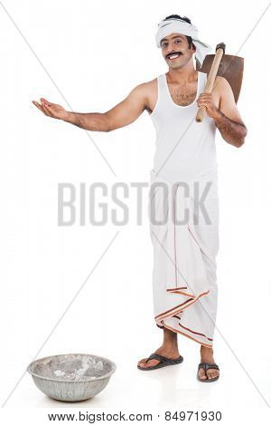 Portrait of a farmer carrying spade on his shoulders and gesturing