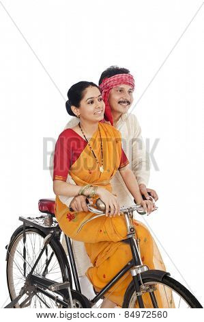 Couple riding a bicycle