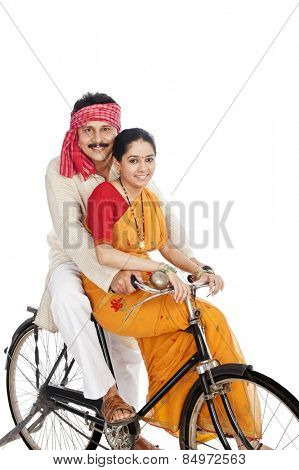 Couple riding a bicycle