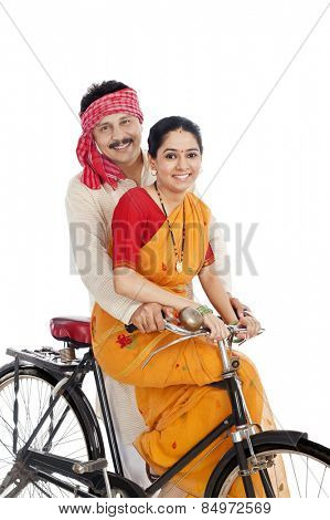 Couple riding a bicycle