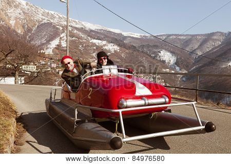 Elderly couple on a pedalo on a road. Situation unreal, surreal