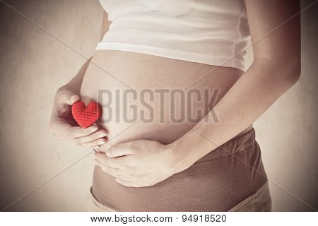Pregnant Woman Holding Her Hand On Belly