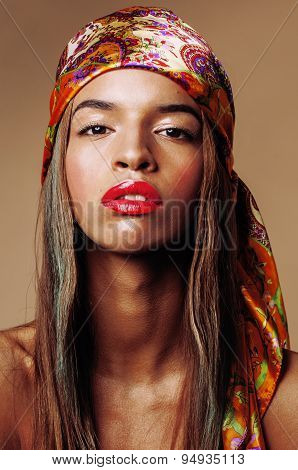beauty young afro american woman in shawl on head smiling close