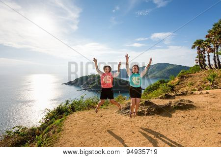 Two Girls Mother And Daughter Jumping