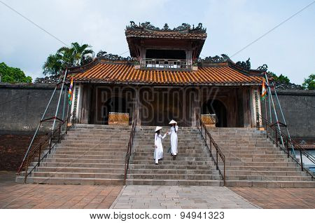 Vietnamese girls with Ao Dai in Tu Duc royal tomb in Hue, Vietnam